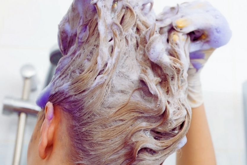 how to fix yellow roots with purple shampoo