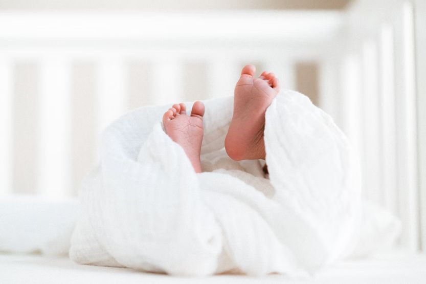 newborn rolling to side while sleeping